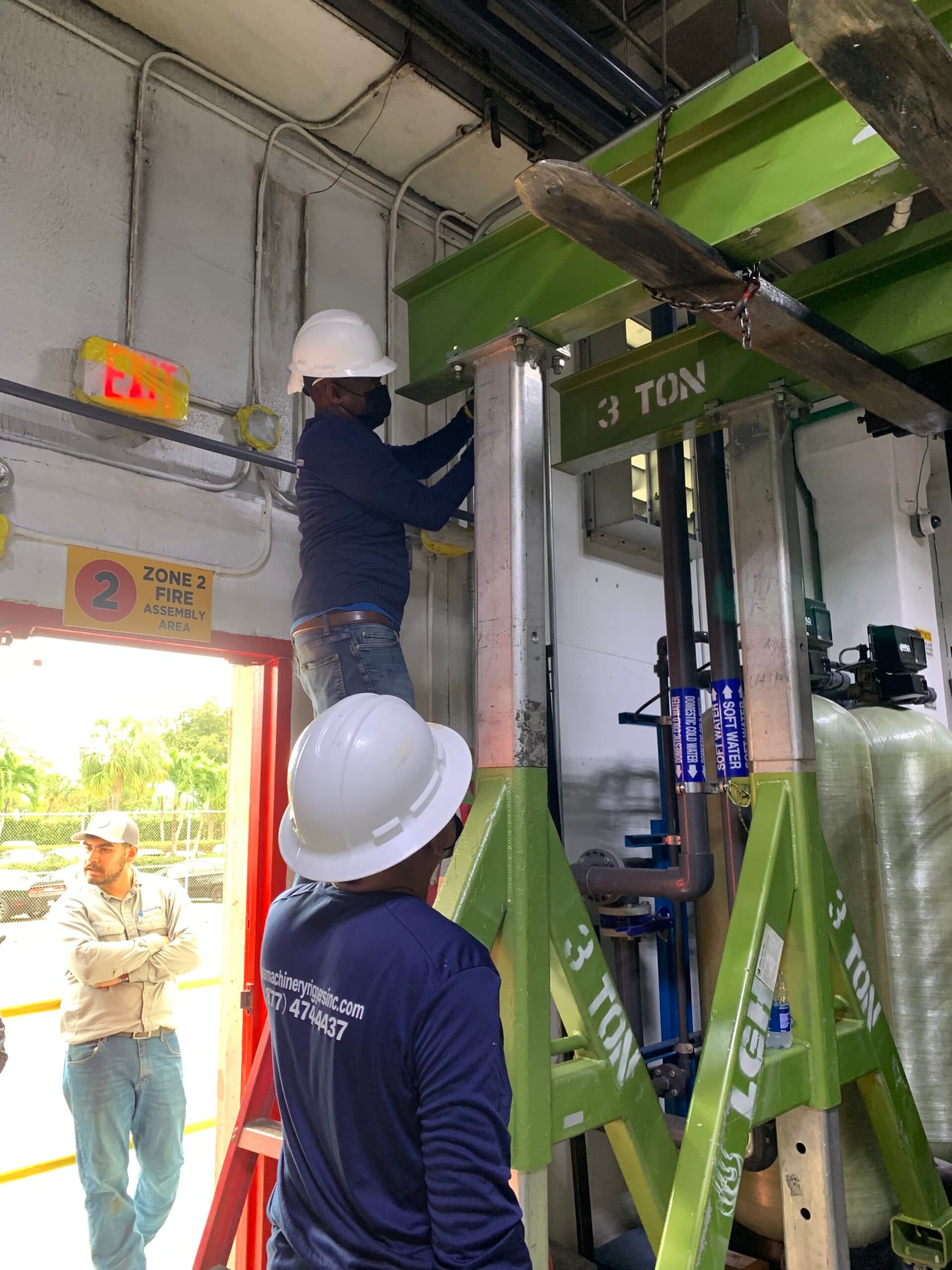 Heavy machinery moving operation inside an industrial facility